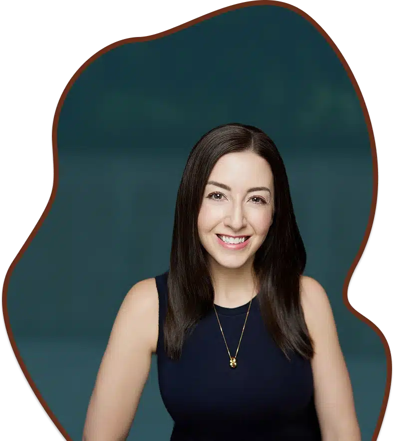 Christine smiling with a gold necklace.