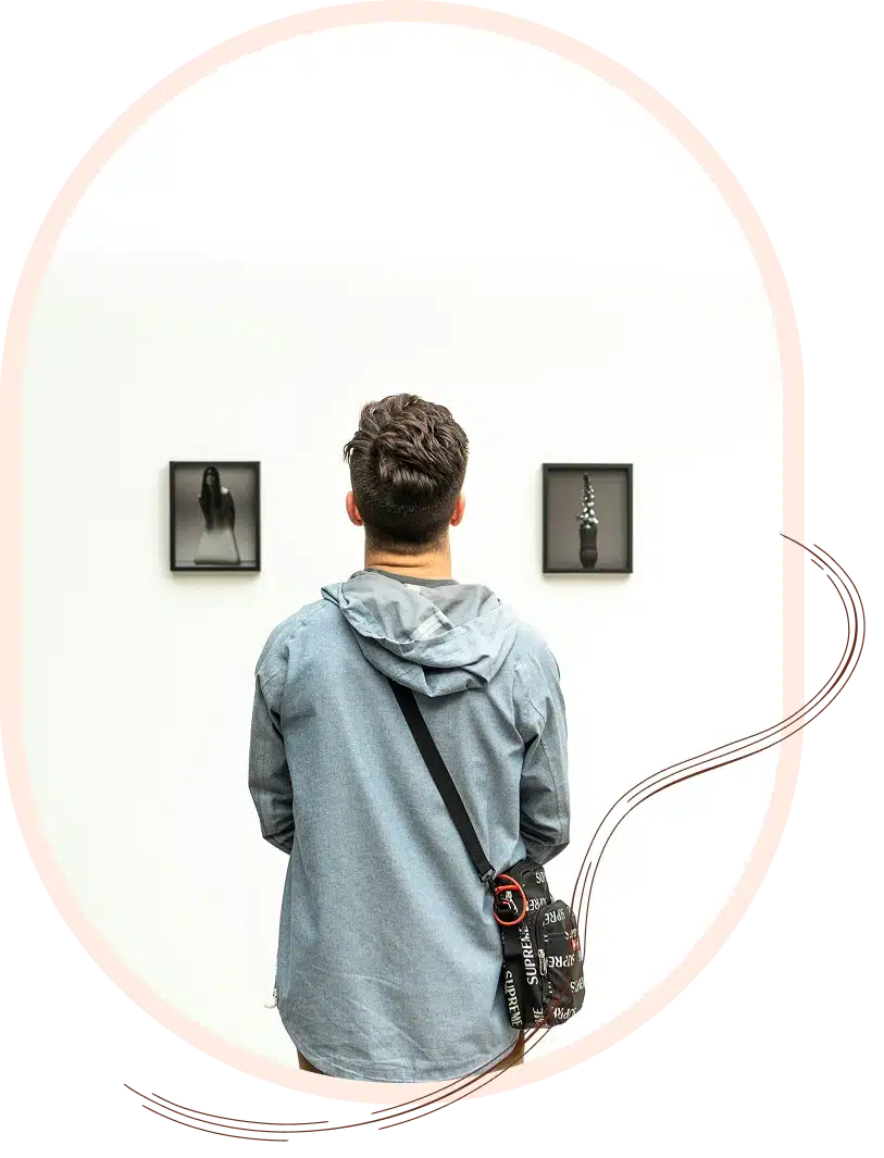 A man views art in a gallery