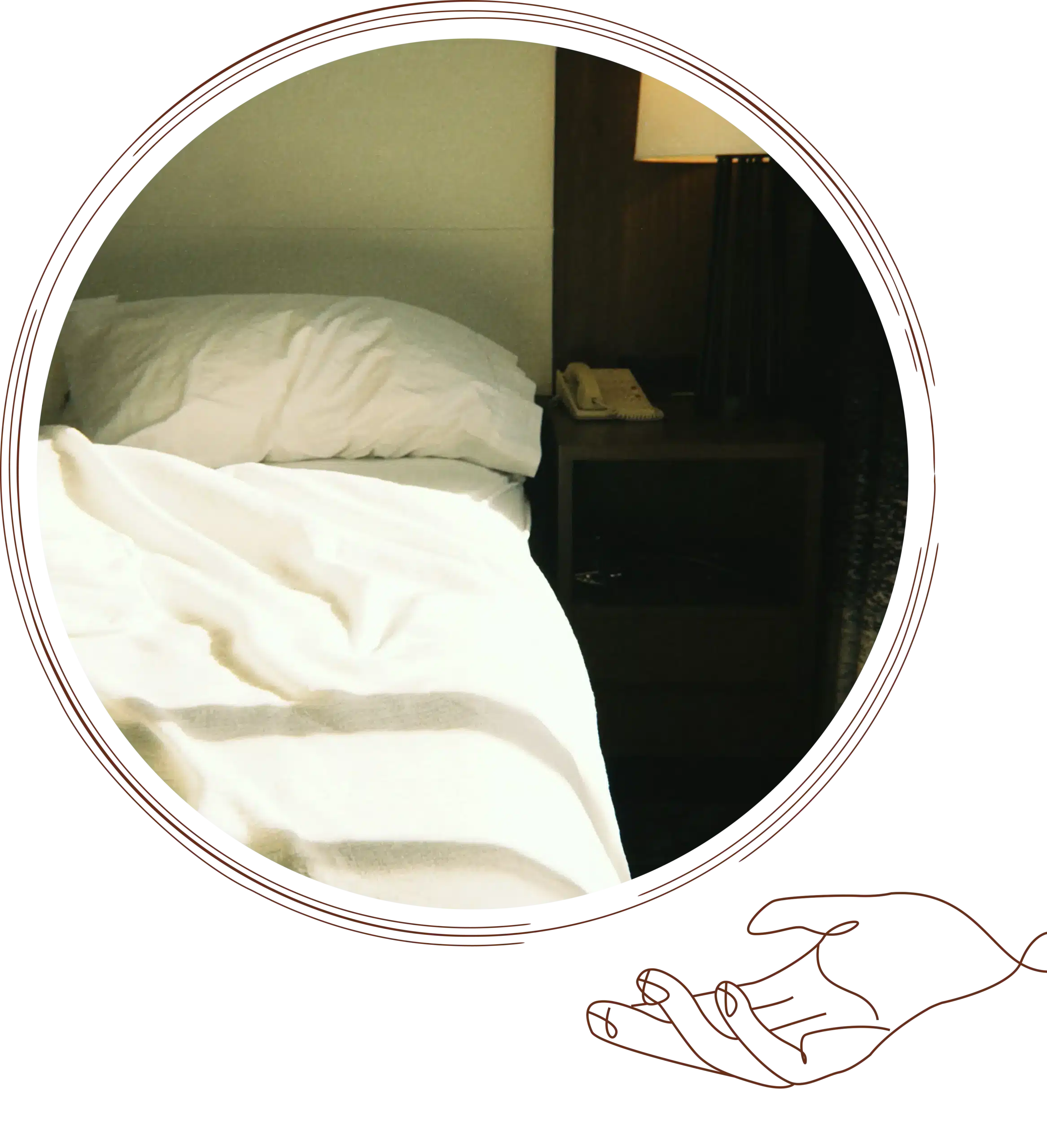 Sunlit hotel bedroom featuring a neatly made bed with white linens, a bedside table with a lamp and telephone, creating a warm and relaxing atmosphere.